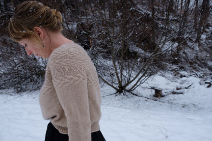 Oksa Sweater | decorative cable pattern in the yoke made from Far by Woolfolk