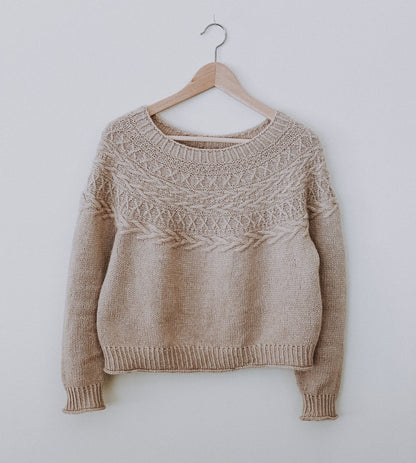 Oksa Sweater | decorative cable pattern in the yoke made from Far by Woolfolk
