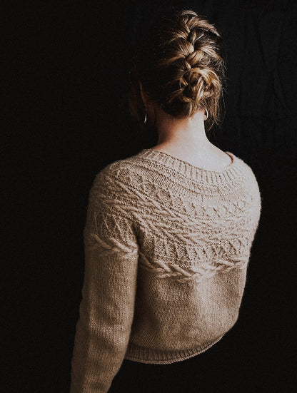 Oksa Sweater | decorative cable pattern in the yoke made from Far by Woolfolk