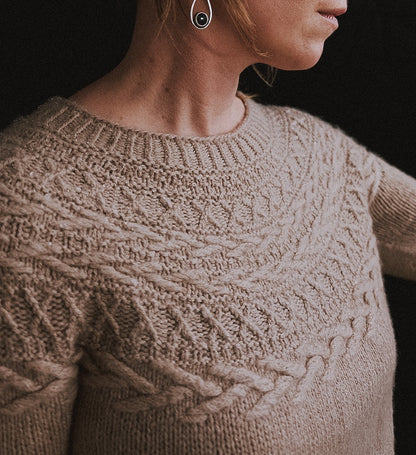 Oksa Sweater | decorative cable pattern in the yoke made from Far by Woolfolk