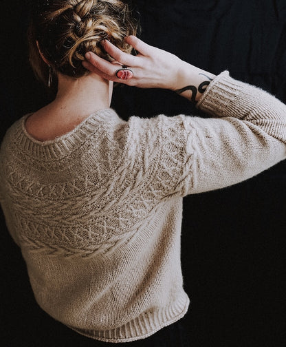 Oksa Sweater | decorative cable pattern in the yoke made from Far by Woolfolk